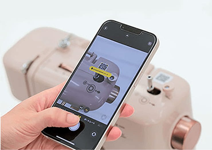 StyleのQRコードをスマートフォンで読み取る様子